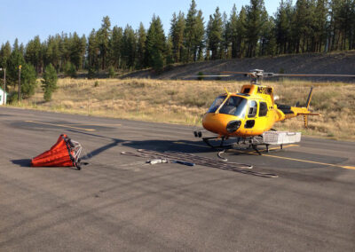 Helicopter with item attached to it