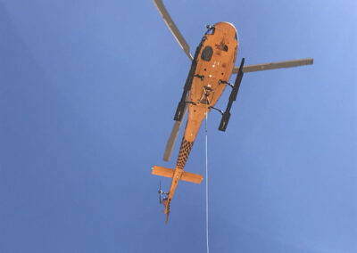 Helicopter in the sky hauling items