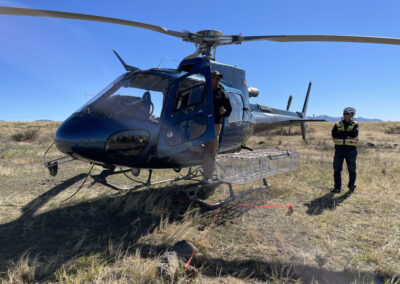 Man exiting blue helicopter