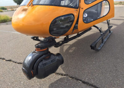 Yellow helicopter with camera attachment