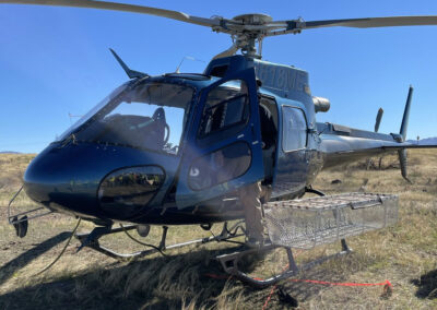 Man exiting blue helicopter