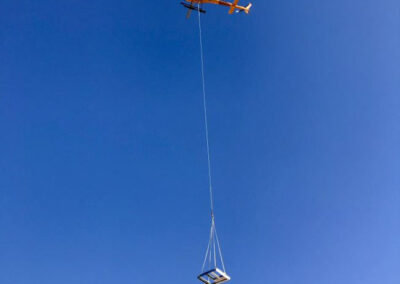 Helicopter in the sky hauling items