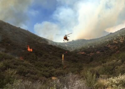 Helicopter aiding in wildfire rescue