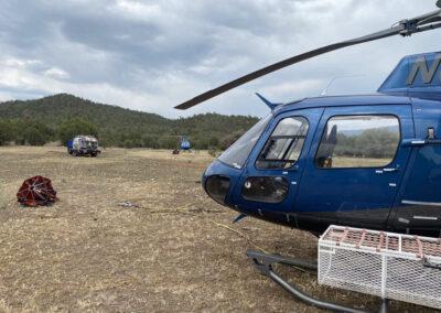 Blue helicopter with equipment outside