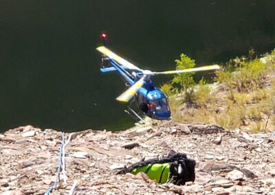 Helicopter landing on side of the mountain