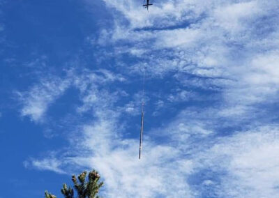 Helicopter in the sky hauling a powerline