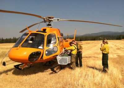 Yellow helicopter with crew outside