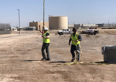 Crew holding the lines to the helicopter