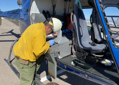 Man working on helicopter