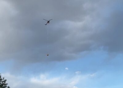 Helicopter in the air hauling items