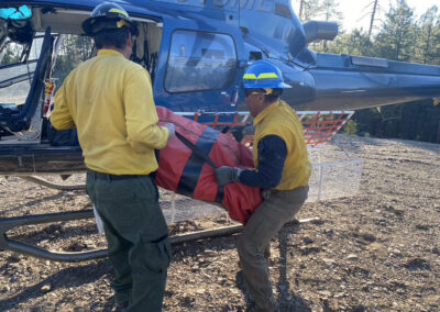 Crew loading items in the helicopter