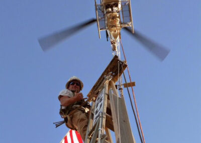 Man posing on top of the powerline