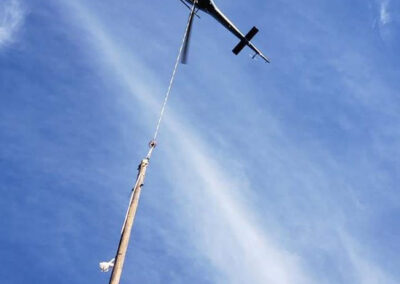 Helicopter in the sky distributing powerlines