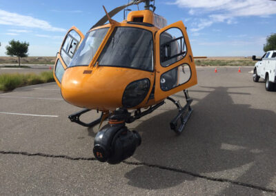 Yellow helicopter with filming equipment