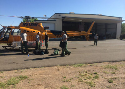 Airmen outside of helicopter